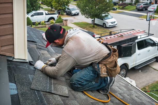 Professional Gutter Repair And Installation technician working in Fitchburg, MA